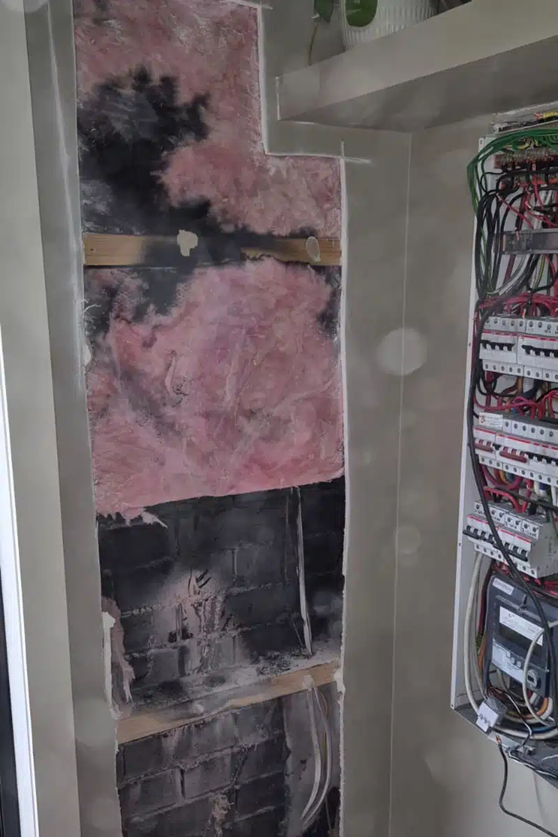 aftermath of electrical fire inside wall