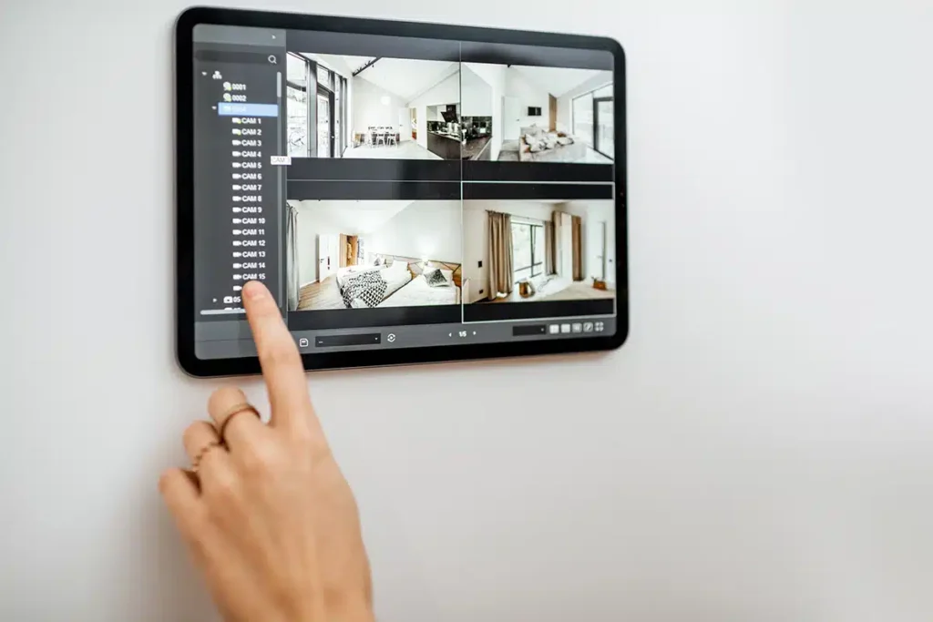 Wall-mounted tablet controlling a home automation system with camera views