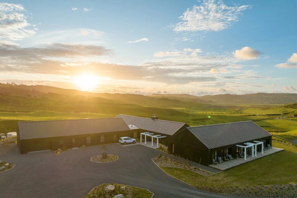 Electrical fit-out Port Waikato - Te Karaka Lodge exterior at sunset