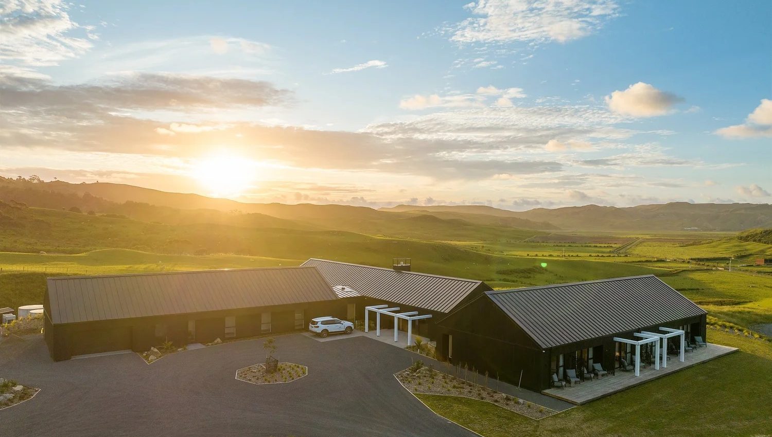 Electrical fit-out Port Waikato - Te Karaka Lodge exterior at sunset